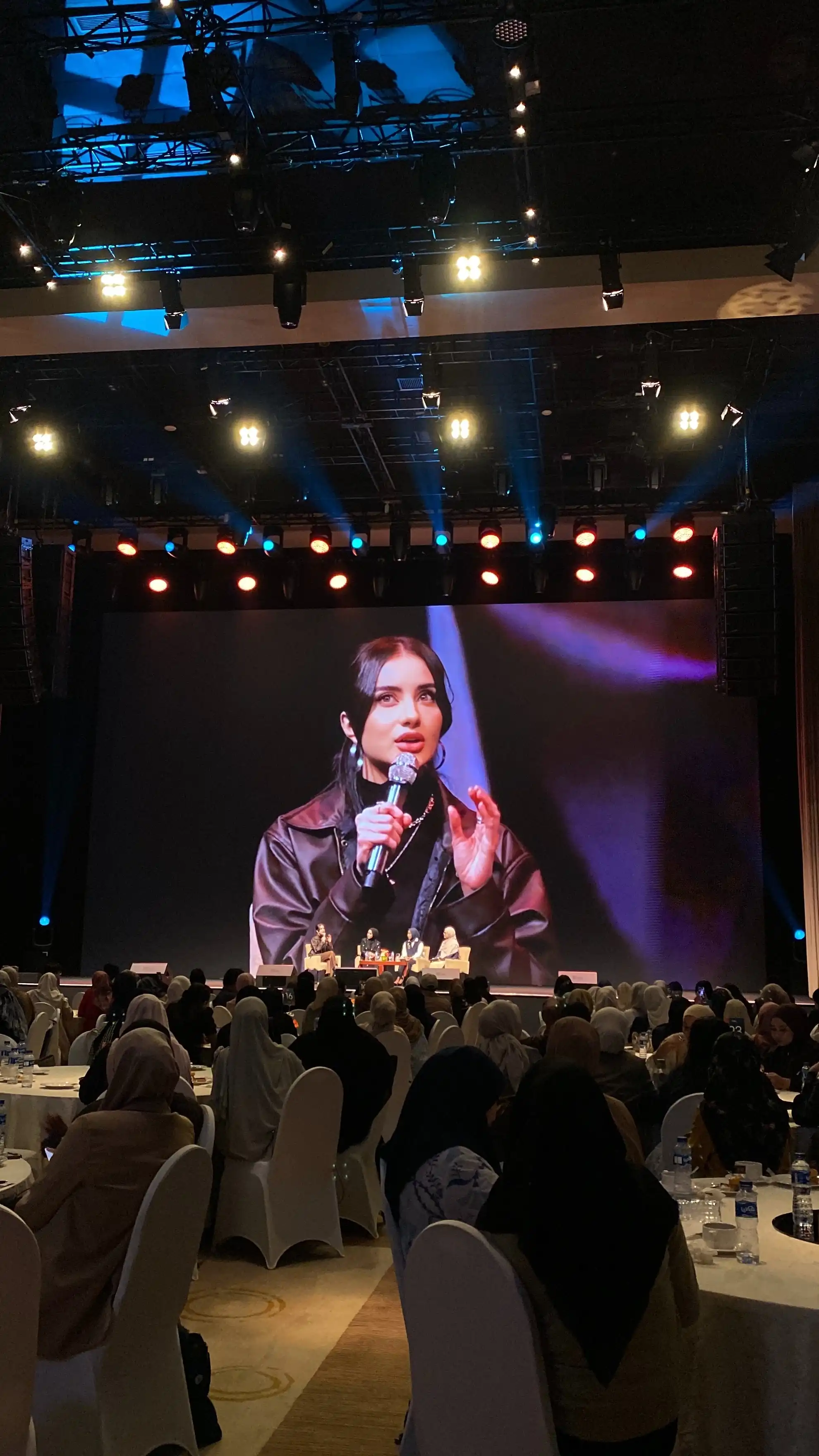 Jakarta Modest Summit 2026 stage screen close-up of a panelist gesturing while speaking